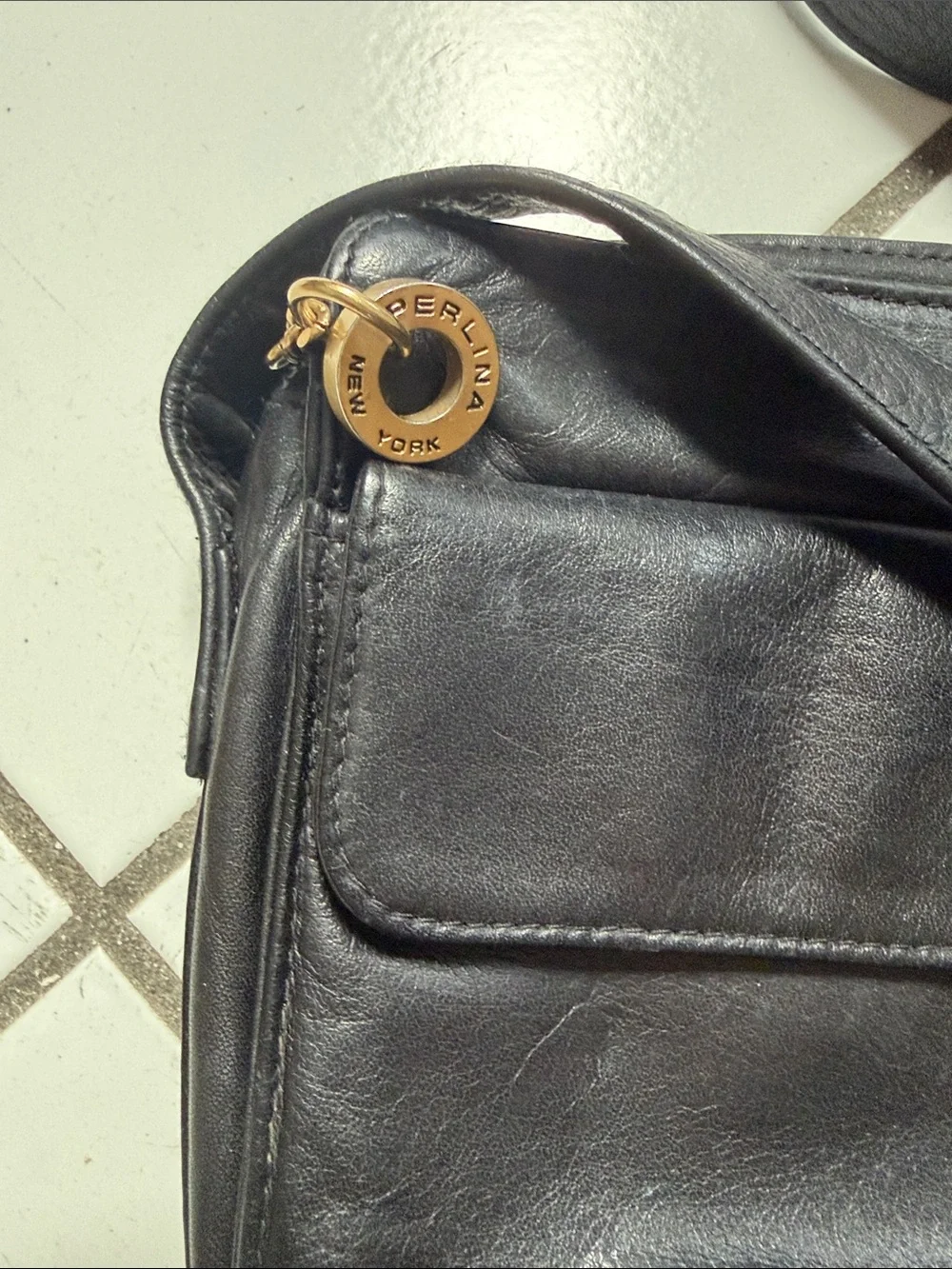 Perlina Black Leather Messenger Bag with Gold Hardware